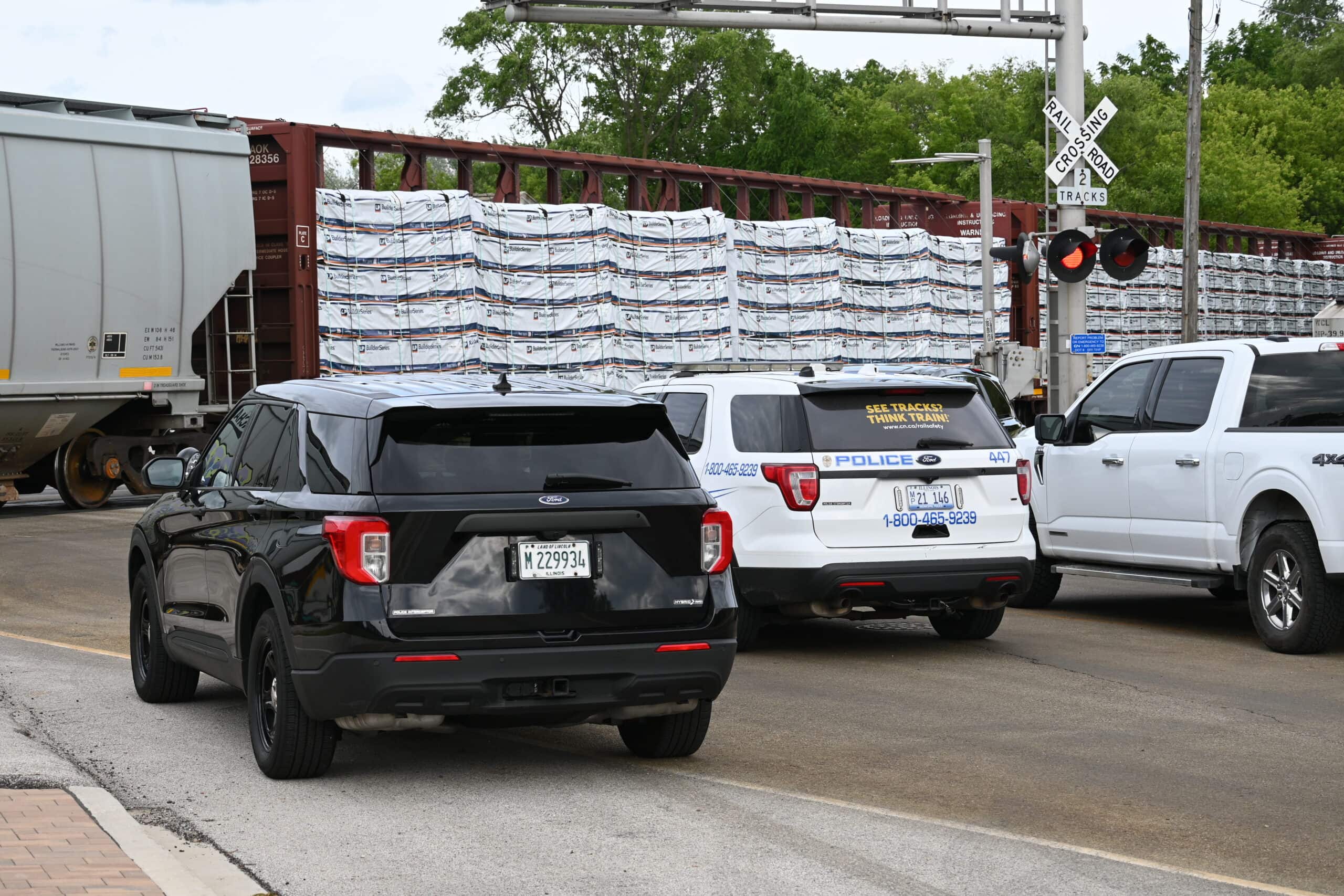 Police investigate the scene of the fatal train crash on East Park Street in Mundelein